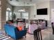 Inviting lounge area with comfortable seating, a large TV, and modern decor, perfect for relaxation and socializing at 6210 Laurel Creek Trl, Ellenton, FL 34222