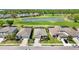 Aerial view of homes with golf course and water view at 6381 Mighty Eagle Way, Sarasota, FL 34241