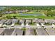 Panoramic aerial view showcases houses near golf course with pond at 6381 Mighty Eagle Way, Sarasota, FL 34241