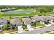 Aerial view of homes with golf course and water view at 6381 Mighty Eagle Way, Sarasota, FL 34241