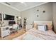 Bedroom with stylish decor, featuring a desk, bed, and modern furnishings at 6381 Mighty Eagle Way, Sarasota, FL 34241