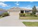 Charming single-story home featuring a well-manicured lawn and an attached two-car garage, offering comfort and convenience at 6381 Mighty Eagle Way, Sarasota, FL 34241