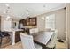 Open concept kitchen, dining room, and island seating area at 6381 Mighty Eagle Way, Sarasota, FL 34241