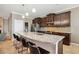 Spacious kitchen with a large granite island, seating, and modern appliances at 6381 Mighty Eagle Way, Sarasota, FL 34241