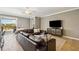 Comfortable living room features a large sectional sofa, media center, and neutral color palette at 6381 Mighty Eagle Way, Sarasota, FL 34241