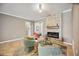 Living room showcases tile floors, a stone fireplace, and comfortable seating at 6381 Mighty Eagle Way, Sarasota, FL 34241