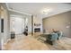 Inviting living room with tile flooring, a stone fireplace, and plenty of natural light at 6381 Mighty Eagle Way, Sarasota, FL 34241