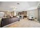 Spacious living area with tile flooring, fireplace, open kitchen, dining, and comfortable seating at 6381 Mighty Eagle Way, Sarasota, FL 34241