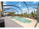 Screened-in pool area with comfortable seating, perfect for relaxation and enjoying the outdoors at 6381 Mighty Eagle Way, Sarasota, FL 34241