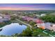 Expansive aerial view of a residential neighborhood with tree-lined streets and multiple ponds at 6458 Tailfeather Way, Bradenton, FL 34203