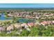 Expansive aerial view of a community with well-maintained homes, ponds, and green spaces at 6458 Tailfeather Way, Bradenton, FL 34203