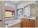 Bright bathroom with a soaking tub, glass shower and spacious vanity at 6458 Tailfeather Way, Bradenton, FL 34203