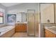Bright bathroom with a soaking tub, glass shower and spacious vanity at 6458 Tailfeather Way, Bradenton, FL 34203