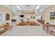 Clubhouse interior featuring a spacious gathering area with tables, chairs, and neutral decor at 6458 Tailfeather Way, Bradenton, FL 34203