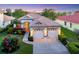 Beautiful single-story home with a tile roof, well-maintained lawn, and mature landscaping at 6458 Tailfeather Way, Bradenton, FL 34203