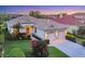 Beautiful single-story home with a well-maintained lawn, colorful flowers, and a two-car garage at 6458 Tailfeather Way, Bradenton, FL 34203