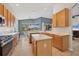 Spacious kitchen with stainless steel appliances, light countertops, and ample cabinet space at 6458 Tailfeather Way, Bradenton, FL 34203