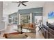 Bright open living area with neutral furniture, high ceilings, and natural light at 6458 Tailfeather Way, Bradenton, FL 34203