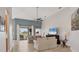 Open living room features high ceilings, neutral tones, and sliding glass doors to the lanai at 6458 Tailfeather Way, Bradenton, FL 34203