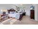 Spacious bedroom features a ceiling fan, large windows and stylish, comfortable furniture at 6458 Tailfeather Way, Bradenton, FL 34203