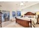 Cozy main bedroom featuring a king-size bed, plush bedding, and a scenic view of the water at 6458 Tailfeather Way, Bradenton, FL 34203