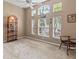 Bright bedroom with many windows, vaulted ceiling, and comfortable seating at 686 Silk Oak Dr, Venice, FL 34293