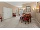 Bright dining room with modern lighting and a large table perfect for Gathering gatherings at 686 Silk Oak Dr, Venice, FL 34293