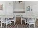 Bright dining room features neutral walls, stylish chairs, and a decorative carpet, offering a comfortable space at 686 Silk Oak Dr, Venice, FL 34293