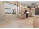 Bright kitchen with large window, stainless steel appliances, and spacious dining area at 686 Silk Oak Dr, Venice, FL 34293
