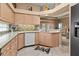 Well-appointed kitchen includes granite countertops, modern appliances, and a stylish backsplash at 686 Silk Oak Dr, Venice, FL 34293