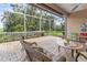 Enjoy the view from the screened lanai with brick pavers and outdoor seating at 686 Silk Oak Dr, Venice, FL 34293