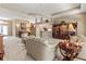 Expansive living room provides ample seating and views into the dining and kitchen areas at 686 Silk Oak Dr, Venice, FL 34293