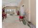 Spacious living room filled with natural light and featuring neutral carpet throughout at 686 Silk Oak Dr, Venice, FL 34293