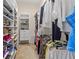 Well-organized walk-in closet offers ample storage with shelves, drawers, and hanging space at 686 Silk Oak Dr, Venice, FL 34293