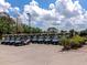 Numerous golf carts neatly lined up in a row, ready for a day on the course at 7035 Owls Nest Ter, Bradenton, FL 34203