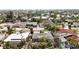 An aerial view of a quiet residential neighborhood with mature landscaping and well-maintained homes at 711 Birdsong Ln, Sarasota, FL 34242