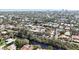 Wide aerial shot showcasing a densely populated residential area alongside a serene waterway at 711 Birdsong Ln, Sarasota, FL 34242
