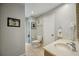 Bathroom featuring modern sink and fixtures, and a separate toilet room at 711 Birdsong Ln, Sarasota, FL 34242