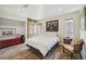Bedroom showcasing wood-look flooring, natural light, and spacious closet at 711 Birdsong Ln, Sarasota, FL 34242