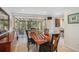 Dining area with a view of screened patio and nicely tiled floors at 711 Birdsong Ln, Sarasota, FL 34242