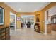 Open-concept layout with bright paint, seamlessly connects the living spaces, dining area, and kitchen at 711 Birdsong Ln, Sarasota, FL 34242