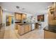 Open kitchen featuring stainless appliances, granite countertops, a breakfast bar and adjacent living space at 711 Birdsong Ln, Sarasota, FL 34242