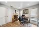 Well-lit home office featuring built-in shelving and a view to the outdoors at 711 Birdsong Ln, Sarasota, FL 34242