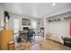 Home office featuring a wooden desk, comfortable chair, and ample storage space at 711 Birdsong Ln, Sarasota, FL 34242