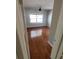 Bedroom with hardwood floors, fan, and a bright window at 835 Indiana Ln, Sarasota, FL 34234