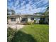 Charming single story home featuring a well-maintained yard with mature landscaping at 835 Indiana Ln, Sarasota, FL 34234