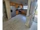 Traditional kitchen with stainless steel appliances, wood cabinets and white painted hardwood floors at 835 Indiana Ln, Sarasota, FL 34234