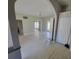 Open-concept living space with white painted hardwood floors and a modern, neutral color palette at 835 Indiana Ln, Sarasota, FL 34234