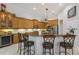 Well-equipped kitchen featuring custom cabinetry, sleek stainless steel appliances, and a functional center island at 8850 17Th Avenue Nw Cir, Bradenton, FL 34209