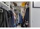 Organized walk-in closet featuring clothing racks and shoe shelves for ample storage at 8850 17Th Avenue Nw Cir, Bradenton, FL 34209